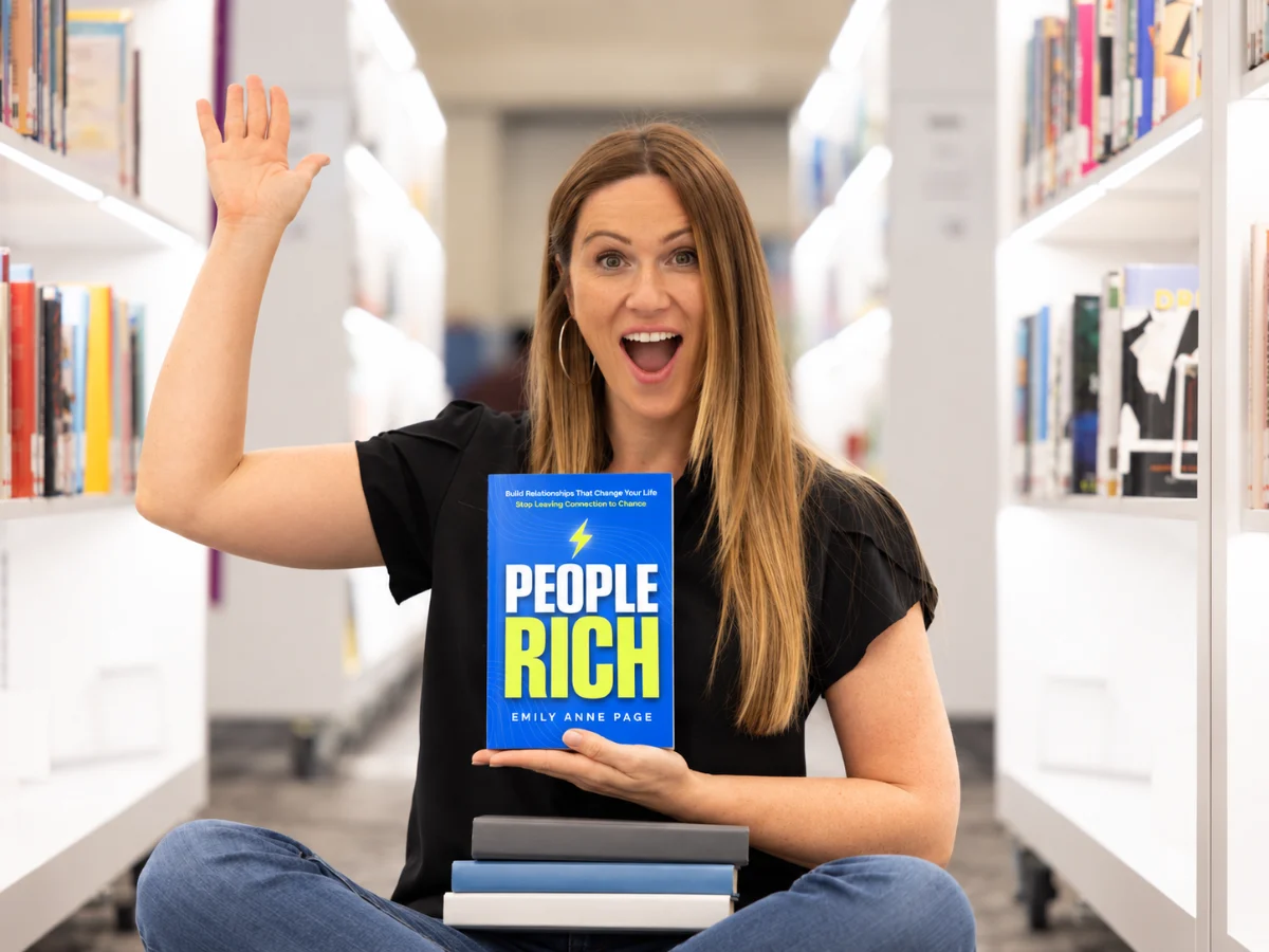 Emily Anne Page holding PEOPLE RICH