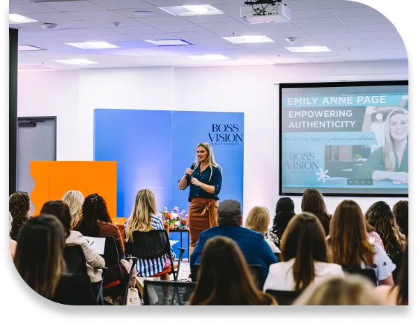 Emily Anne Page speaking on stage at an industry conference