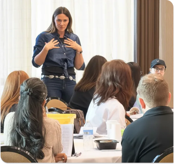 Emily Anne Page coaching a room of business owners